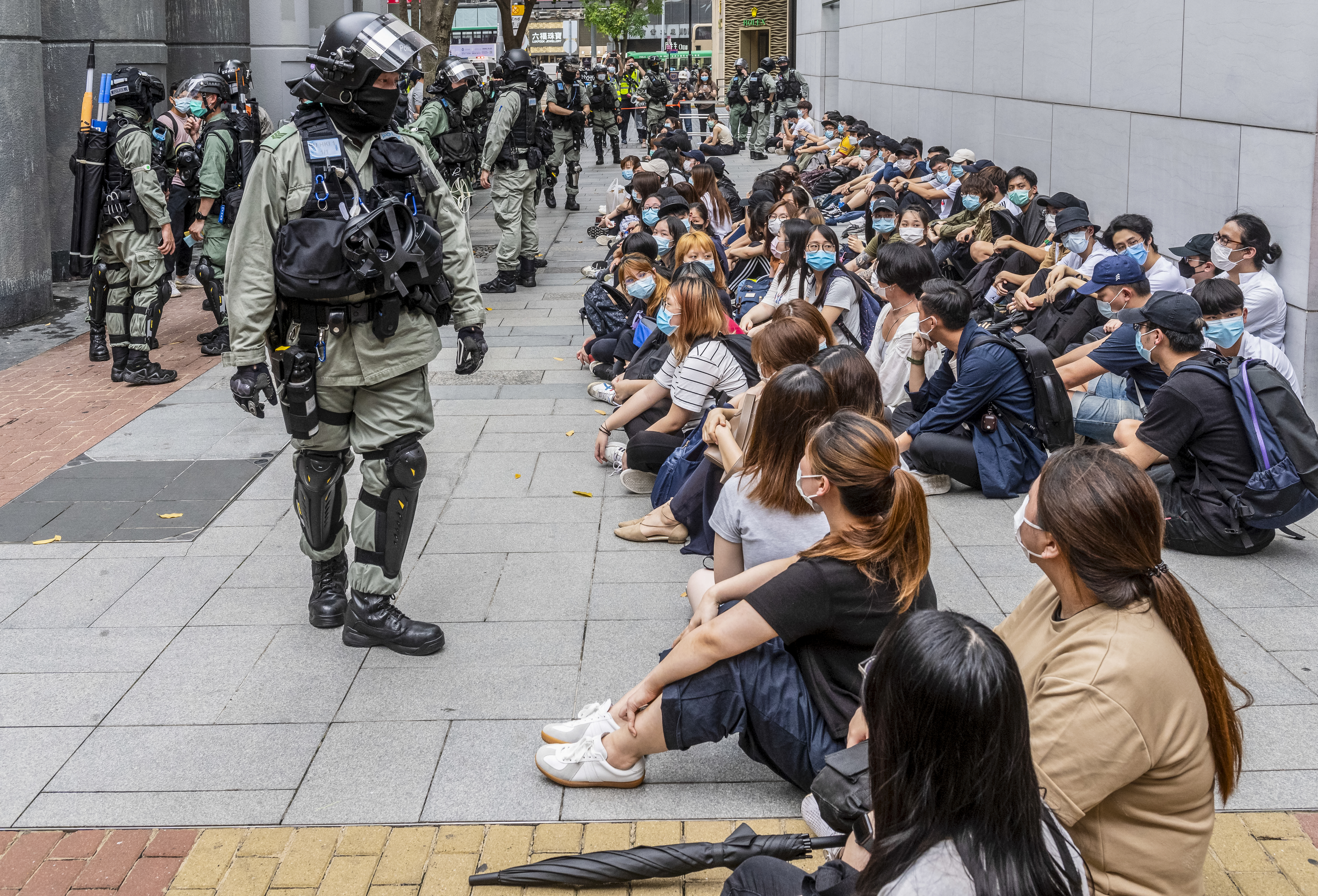 Hong Kong police arrest 300 as thousands protest over security laws