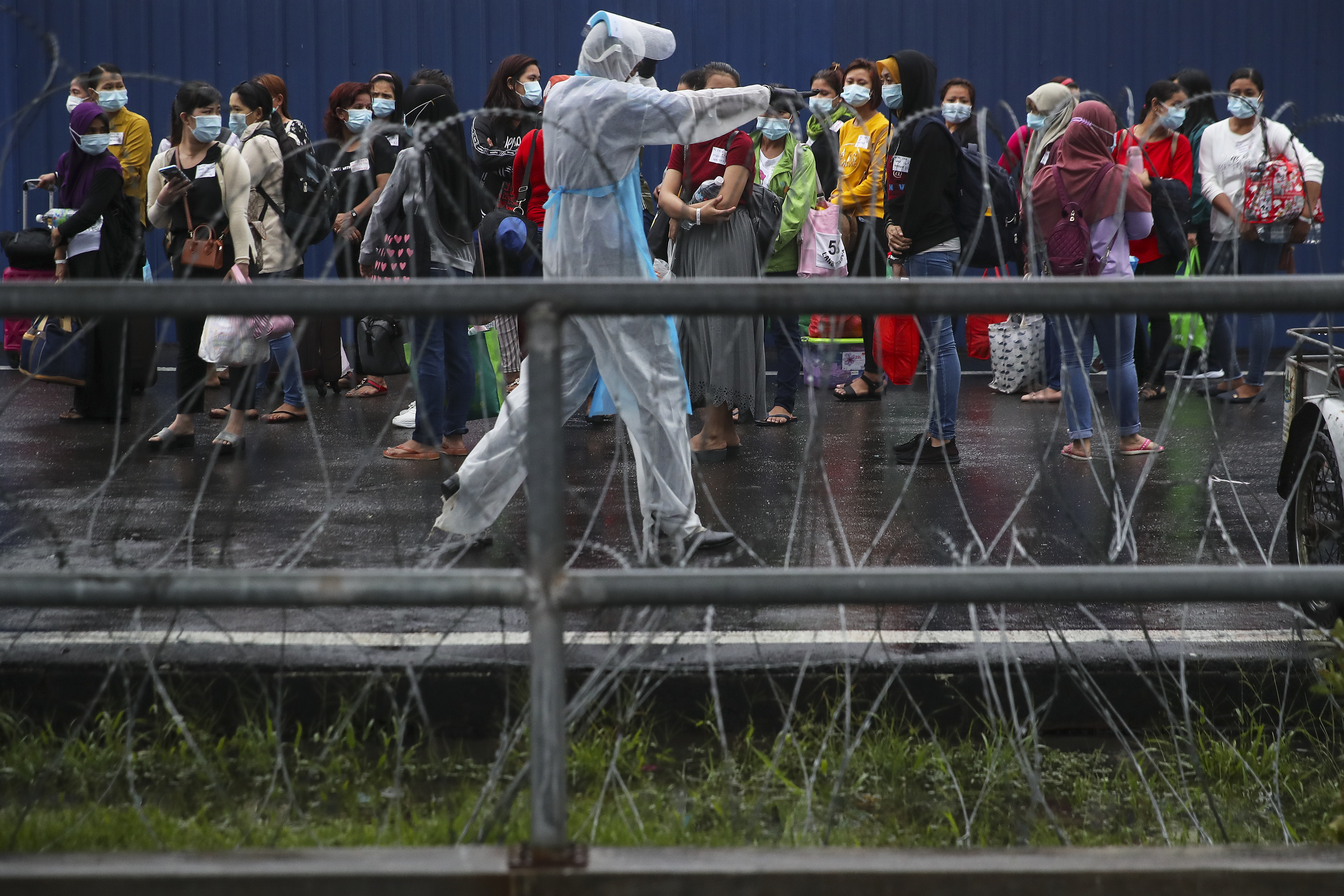 Top Glove warns on deliveries after virus outbreak shuts plants