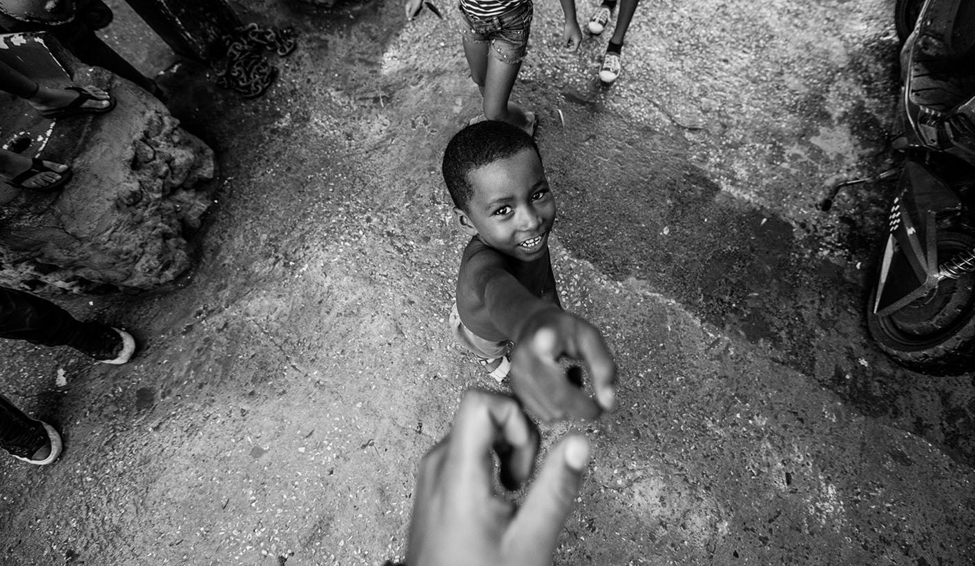 Op-Ed: How to lend a helping hand that is more than about charity