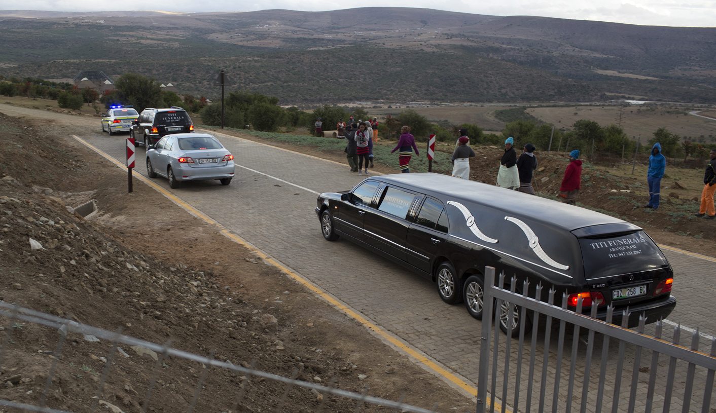Police, workers exhume Mandela's children