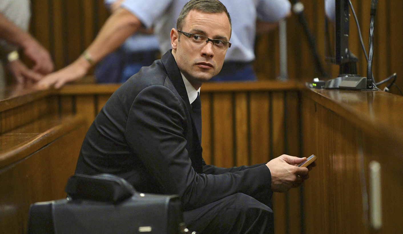 Olympic and Paralympic track star Pistorius sits in the dock during court proceedings at the North Gauteng High Court in Pretoria
