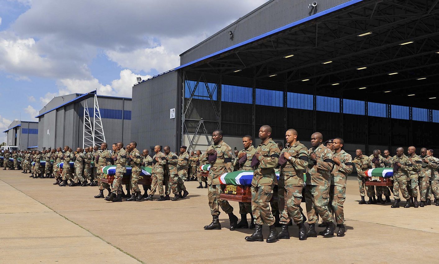 Members of the SANDF carry the mortal remains of 13 members that were killed in CAR during the handing over to the respective families at the Waterkloof Air Force Base, in Pretoria
