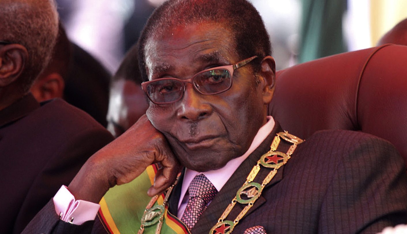 Zimbabwe's President Mugabe looks on during a rally marking Zimbabwe's 32nd independence anniversary celebrations in Harare