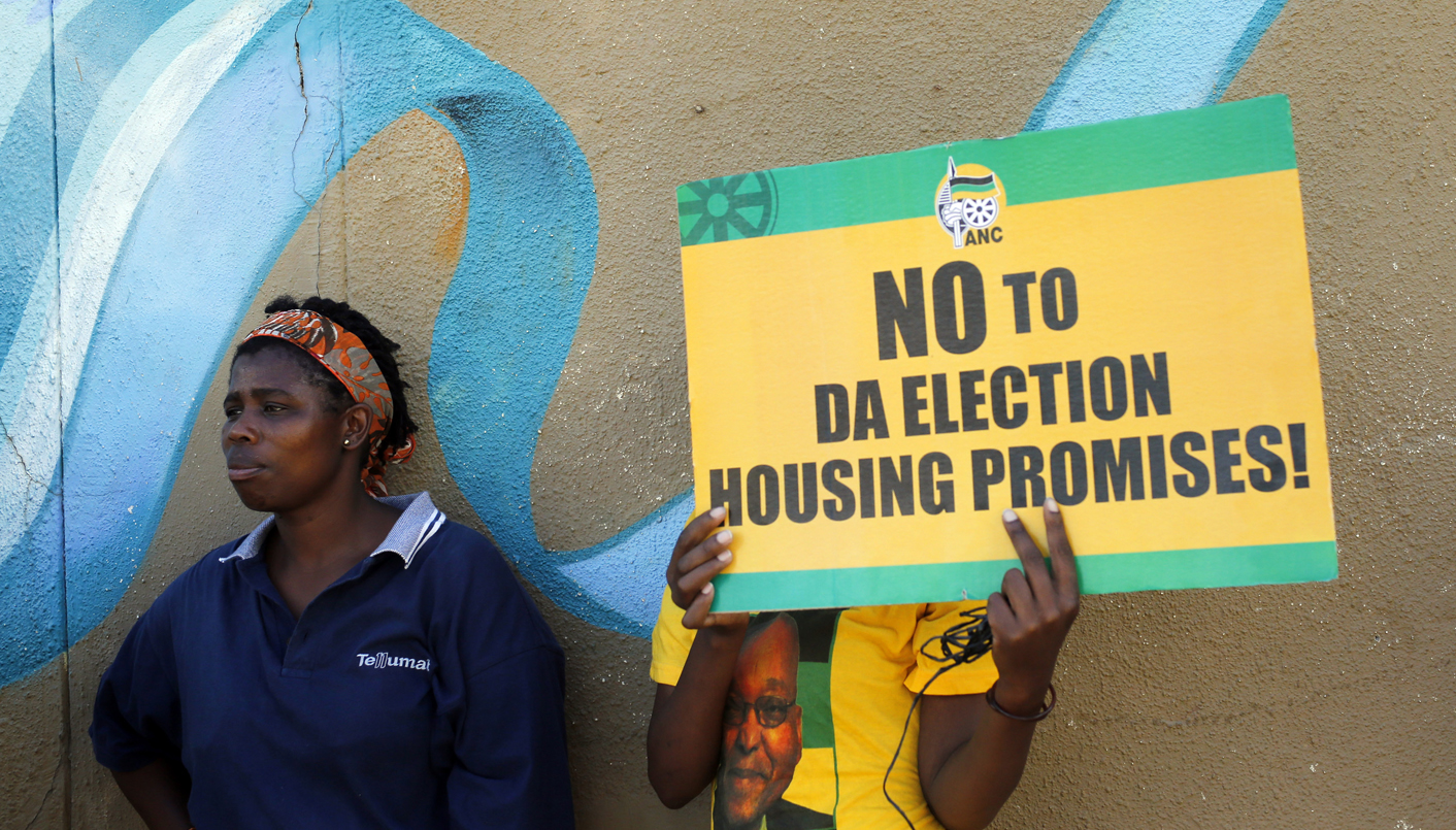 Supporters of President Jacob Zuma's ruling African National Congress (ANC) await the start of a march on the headquarters of the opposition Democratic Alliance in Cape Town