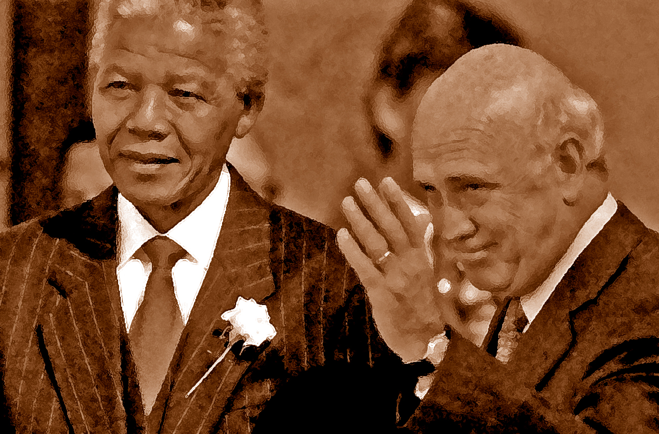 Outgoing South African President F.W. de Klerk waves goodbye next to President - elect Nelson Mandel..