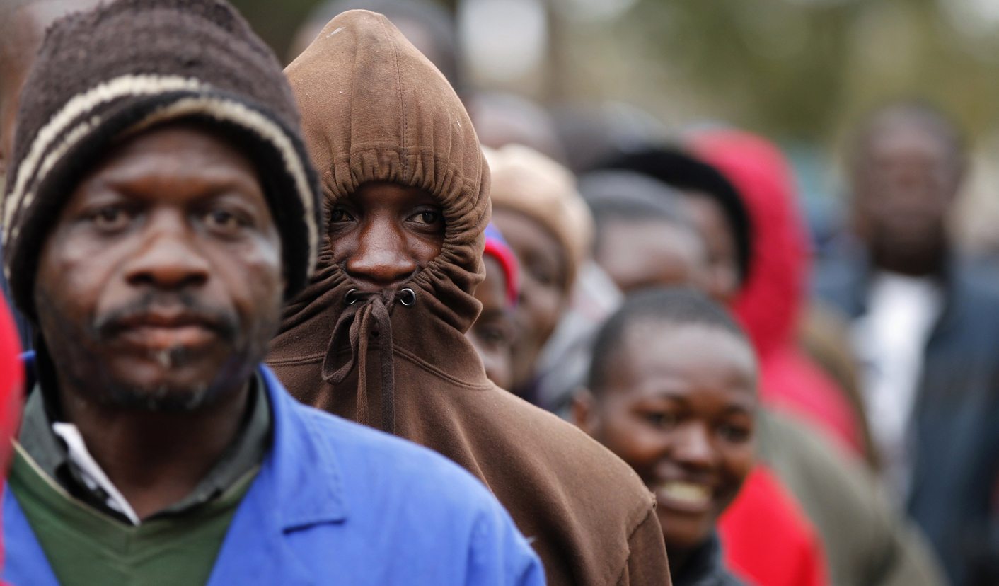 Zimbabweans wait to cast their vote in Mbare township