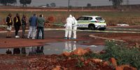 Police investigate the crime scene where the body of the ninth woman was found in Villa Liza