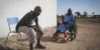 Two senior citizens sit outside, enjoying the afternoon sun.  Socialisation helps senior citizens maintain their self-esteem and sense of worth. (Photo: Shiraaz Mohamed)