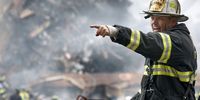 394558 09: Retired Fire Chief Joseph Curry barks orders to rescue teams as they clear through debris that was once the World Trade Center September 14, 2001 in New York City. (U.S. Navy Photo by Jim Watson/Getty Images)