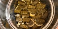 Dolmades, layered, with lemon slices in between. (Photo: Tony Jackman)