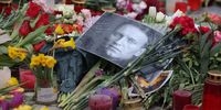 A photo of Russian opposition figure Aleksei Navalny lies among candles and flowers at a makeshift memorial to him in front of the Russian Embassy on February 24, 2024 in Berlin, Germany. Navalny died under ambiguous circumstances in a Siberian prison around February 16.  (Photo by Sean Gallup/Getty Images)
