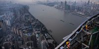 WUHAN, CHINA - NOVEMBER 15: (CHINA OUT) Construction workers are seen on the roof top of the Wuhan Greenland Center skyscraper on November 15, 2021 in Wuhan, Hubei, China. Wuhan Greenland Center will be the tallest building in Central China and is expected to be completed by 2022 with a height of nearby 476m, making it the 15th tallest building in the world. (Photo by Getty Images)
