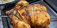 My rotisserie chicken, take 5: with baby potatoes roasted in a dripping tray below the rotisserie. (Photo: Tony Jackman)