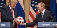 HELSINKI, FINLAND - JULY 16:  Russian President Vladimir Putin hands U.S. President Donald Trump (L) a World Cup football during a joint press conference after their summit on July 16, 2018 in Helsinki, Finland. The two leaders met one-on-one and discussed a range of issues including the 2016 U.S Election collusion.  (Photo by Chris McGrath/Getty Images)