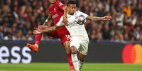 Eder Militao of Real Madrid competes with Cody Gakpo of Liverpool during the UEFA Champions League round of 16 leg two match between Real Madrid and Liverpool FC at Estadio Santiago Bernabeu on 15 March 2023 in Madrid, Spain. (Photo: Chris Brunskill/Fantasista/Getty Images)