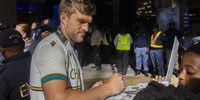 Wiaan Mulder signing autographs during the South Africa men's national cricket team arrival at OR Tambo International Airport on June 18, 2025 in Johannesburg, South Africa. (Photo by Gallo Images/Alet Pretorius)