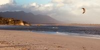 Kite surfing at the Lagoon mouth at Grotto Beach Hermanus.