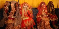 Pakistani brides attend their wedding during a mass wedding ceremony in Hyderabad, Pakistan, 13 October 2023. The Jeelani welfare trust and and Abdul Aziz memon trust funded the mass wedding of 15 couples for people belonging to poorer classes.  EPA-EFE/NADEEM KHAWAR
