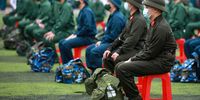 epa09039486 Recruits sit in line during a military recruitment ceremony held at Dong Da district in Hanoi, Vietnam, 27 February 2021. More than 4,000 recruits attend the recruitment ceremony in 30 districts of Hanoi on 27 February. Before joining the army, all the recruits were tested for Covid-19 coronavirus amid the Covid-19 pandemic situation.  EPA-EFE/LUONG THAI LINH