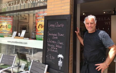 Surrounded by Riesling country, a German wine seller says cheers