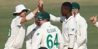 South African bowler Kagiso Rabada (right) and  team-mates celebrate the dismissal of Pakistani batsman Hassan Ali during the third day of the first cricket test match between Pakistan and South Africa in Karachi. (Photo: EPA-EFE / Shahzaib Akber)