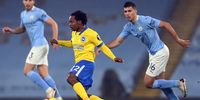 Rodrigo (right) of Manchester City in action against Percy Tau (centre) of Brighton during the English Premier League soccer match between in Manchester, Britain, on 13 January 2021.  (Photo: EPA-EFE / Laurence Griffiths)
