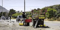 A woman sells fruit and vegetables on Kommetjie Road. (Photo: Daniel Steyn)