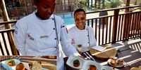 First year student, Lihle Mahambehlala, serves Chef Andiswa Mqedlana with a heritage starter trio, developed for a recent brunch. (Photo: Wanda Hennig)<br>