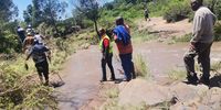 Amathole District Municipality officials and residents search for three missing family members after their car was swept into the flooded Shixini River. (Photo: Supplied)