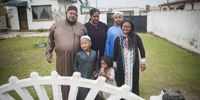 The Lunat family outside their Eldorado Park, Johannesburg home on the morning of Eid. (Photo: Daily Maverick / Shiraaz Mohamed)