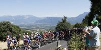 Spectators watch the peloton in action during the 13th stage of the Tour de France 2022. (Photo: EPA-EFE / Yoan Valat)