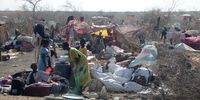 People who fled the violence in Sudan, sit at informal shelters near the transit area set by the UNHCR in the Upper Nile State town of Renck, South Sudan, 12 May 2023. (Photo: EPA-EFE/Amel Pain)