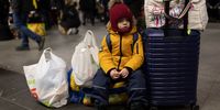 BERLIN, GERMANY - MARCH 08: Boy waits with his mom as people fleeing war-torn Ukraine arrive from Poland at Hauptbahnhof main railway station on March 08, 2022 in Berlin, Germany. Over one million people, mainly Ukrainian women and children as well as foreigners living or working in Ukraine, have fled Ukraine as the current Russian military invasion continues to inflict growing casualties on the civilian population. (Photo by Maja Hitij/Getty Images)