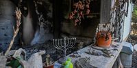 A Hanukkah menorah is left on a counter of a destroyed house after Hamas attacked this kibbutz on October 7th near the border of Gaza on November 01, 2023 in Kissufim, Israel. More than three weeks since Hamas's Oct 7 attacks in Israel, which killed 1,400 according to Israeli authorities, just over half have now been laid to rest, and over four-fifths have been identified. Volunteers continue to identify victims at the country's Shura military facility. (Photo by Alexi J. Rosenfeld/Getty Images)