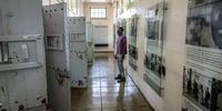 A man looks into the black inmates’ isolation cells where women were placed in solitary confinement at the women’s jail. (Photo: Shiraaz Mohamed)