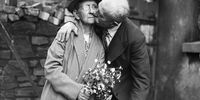 26th July 1936:  76 year old Evan Ellis of Anglesey kissing his bride, 70 year old Mary Ann Kinsley after their wedding at Ton Pentre, Rhondda.  (Photo by Richards/Fox Photos/Getty Images)