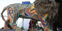 An artist works on a lion installation as part of preparations for the Jewish holiday of Purim parade in Jerusalem, 20 March 2024. The municipality of Jerusalem decided to hold the annual parade of the Purim festival for the first time since 1982 despite appeals from the representatives of the families of the Israelis held by Hamas in Gaza, who asked the municipality to consider the situation of conflict and postpone the parade.  EPA-EFE/ABIR SULTAN