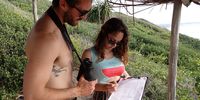 Mikel Gutiérrez Muto (left) research coordinator and Lucía Achiaga Bello (right) intern record information about the whales in Zavora Bay during a whale survey. Photo:Rio Button
