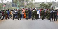 Kenyan anti-riot police (centre), look on as supporters of the Azimio la Umoja political coalition of losing presidential candidate and Kenya’s opposition leader Raila Odinga shout slogans before the announcement the winner. (Photo: EPA-EFE / Daniel Irungu)