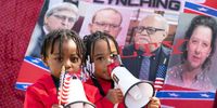 BRUNSWICK, GA - NOVEMBER 24: Three year-old Curtis Hayes III and four year-old T'Kyrra Terrell use megaphones outside the Glynn County Courthouse as the jury deliberates in the trial of the killers of Ahmaud Arbery on November 24, 2021 in Brunswick, Georgia. Greg McMichael, his son Travis McMichael, and a neighbor, William "Roddie" Bryan were found guilty in the February, 2020 fatal shooting of 25-year-old Ahmaud Arbery. (Photo by Sean Rayford/Getty Images)