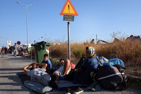 Migrants without shelter on Lesbos after fire, locals oppose shelter plans