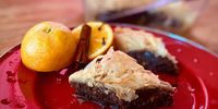 Baklava, served up, with the orange, cinnamon stick and cloves that were used to make the syrup. (Photo: Tony Jackman)