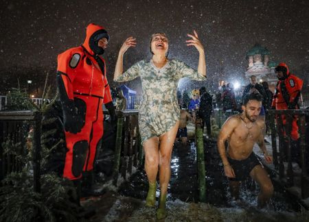 Christians swim in ice-cold water for Orthodox Epiphany holiday, and more from around the world