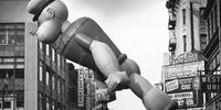 26th November 1961:  An inflated Popeye floats above the Thanksgiving Day Parade in New York as it nears Times Square.  (Photo by William Lovelace/Express/Getty Images)