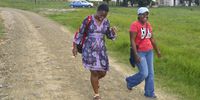 In this file photo from 2014 Thuthukile Mbatha, a senior researcher at SECTION27 and Thandeka Vinjwa walk the backroads of the Eastern Cape to document the stories of people relying on a broken healthcare system. (Photo supplied: Treatment Action Campaign)
