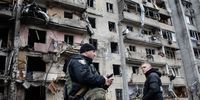 Residents and police inspect a fire damaged building following a blast at around 4am during Russian artillery strikes in Kyiv, Ukraine, on Friday, Feb. 25, 2022. Ukraines president said Moscow-led forces were continuing attacks on military and civilian targets on the second day of their invasion after the U.S. and its allies imposed new sanctions on Moscow and U.S. President Joe Biden warned of "a dangerous moment for all of Europe." Photographer: Erin Trieb/Bloomberg via Getty Images