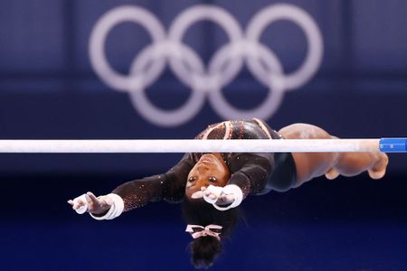Star gymnast Simone Biles says she should have quit before Tokyo Games