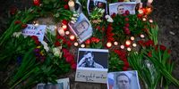 Flowers and candles are left at a memorial on 16 February 2024 in front of the Russian embassy in Berlin, after the announcement that the Kremlin's most prominent critic Alexei Navalny had died in an Arctic prison.  Navalny's death after three years in detention and a poisoning which he blamed on the Kremlin, deprives Russia's opposition of its figurehead. (Photo: John MACDOUGALL / AFP)