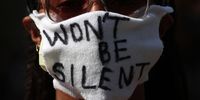 WASHINGTON, DC - JUNE 03: A demonstrator wears a mask that reads "Wont Be Silent" during a peaceful protest on Pennsylvania Avenue in front of the Trump International Hotel to protest against police brutality and the death of George Floyd, on June 3, 2020 in Washington, DC. Protests in cities throughout the country have been been held after the death of George Floyd, a black man who was killed in police custody in Minneapolis on May 25.  (Photo by Win McNamee/Getty Images)