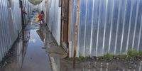 CAPE TOWN, SOUTH AFRICA - AUGUST 27: A flooded Masiphumele Informal Settlement on August 27, 2021 in Cape Town, South Africa. It is reported that the heavy storm which hit the Western Cape last night left many of the 400 plus temporary homes that were built on the only sports field in Masiphumele flooded. After a fire ravaged over 1000 homes just days before Christmas the City said they had no other place to build them but, on the sports field. (Photo by Gallo Images/Brenton Geach)